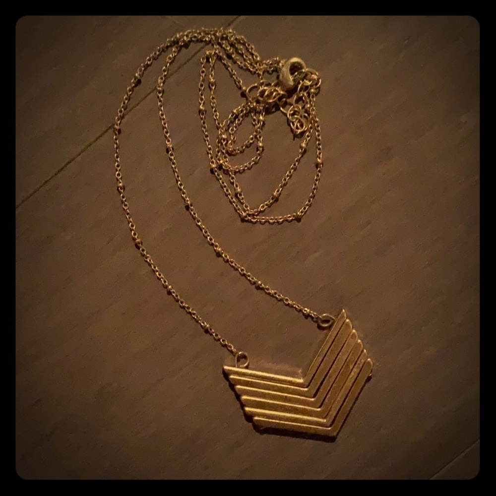 Gold colored pendent necklace